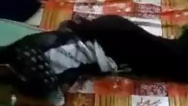 Indian girl lies in the bed but man wants to film a porn movie about her