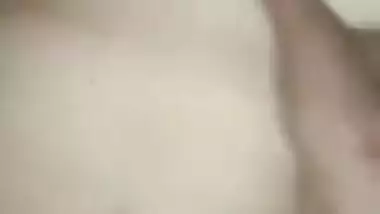 Wife lies on the bed letting the Desi hubby film the porn video