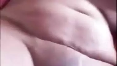 Indian chick in a red robe bares her natural XXX breasts to the sex fan