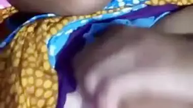 Pretty Desi MILF poses for the camera and teases with big XXX tits