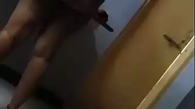 Hot figure standing topless in front of mirror