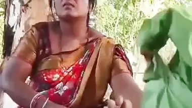 Outdoor sex of a handicapped man with a milf in the jungle