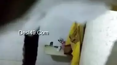 There is a hole in the bathroom and perv films the naked Indian