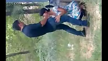 records a young couple enjoying oral sex behind their house