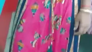 Hot like hell Desi female in sexy pink dress poses for the camera