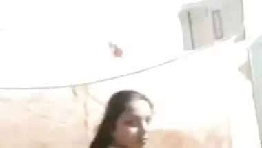 Sexy housewife strips and shakes her big Desi booty for the camera